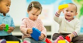 Diverse group of babies playing.